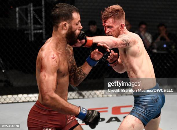 Austin Arnett punches Brandon Davisin their featherweight bout during Dana White's Tuesday Night Contender Series at the TUF Gym on August 1, 2017 in...