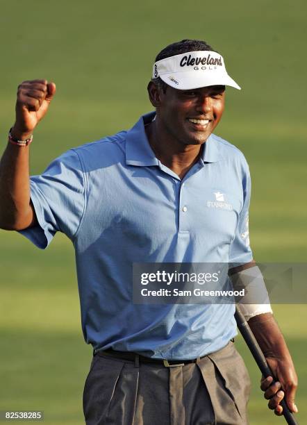 Vijay Singh of Fiji reacts to a birdie putt on the first playoff hole after the final round of The Barclays at Ridgewood Country Club on August 24,...