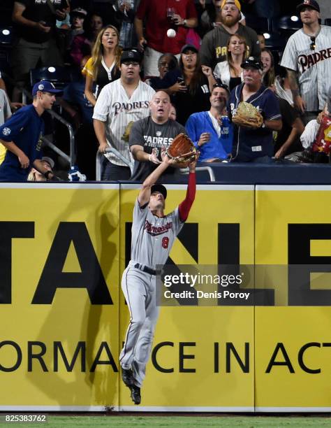 Zach Granite of the Minnesota Twins makes a catch at the wall on a ball hit by Jose Pirela of the San Diego Padres during the fourth inning of a...