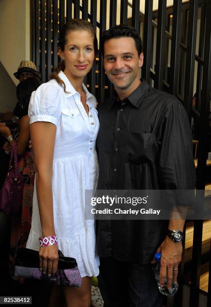 Alysia Reiner and television personality David Alan Basche pose at Los Angeles Confidential Magazine's Cover Party with Selma Blair at the Crescent...
