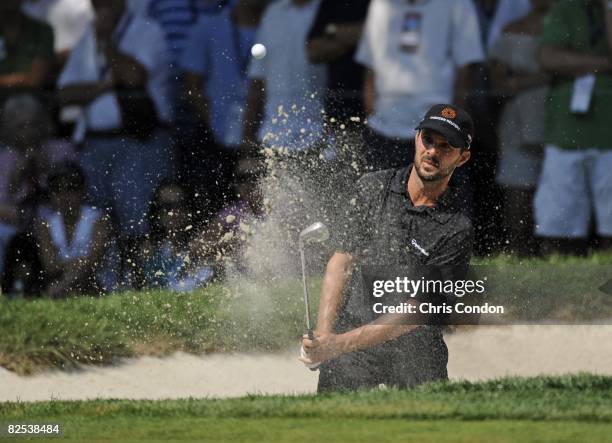 Mike Weir of Canada hits from a bunker on during the final round of The Barclays held at the Ridgewood Country Club on August 24, 2008 in Paramus,...