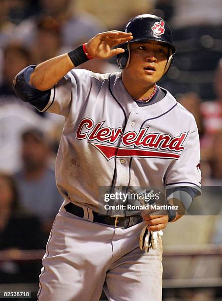 Shin-Soo Choo of the Cleveland Indians celebrates a run against the Texas Rangers in the 4th inning on August 24, 2008 at Rangers Ballpark in...