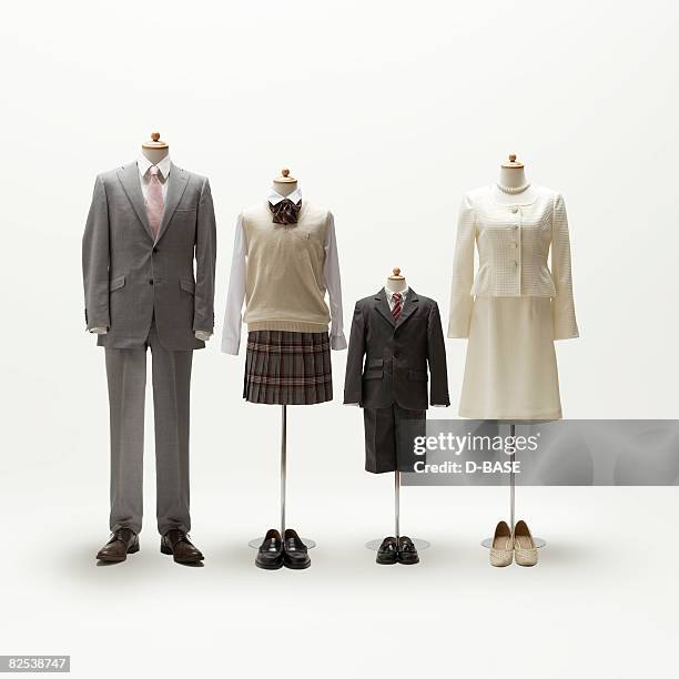 family mannequin dressing formal wear. - formal shoes stock pictures, royalty-free photos & images