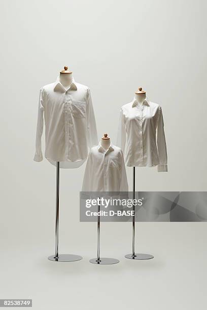 family mannequin dressing a white shirt. - white shirt stock pictures, royalty-free photos & images