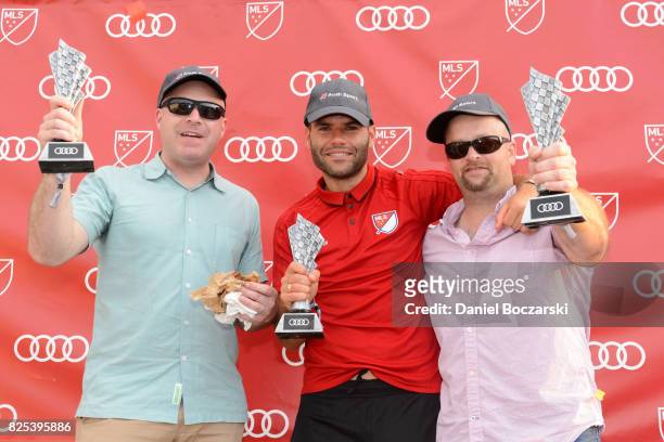 Nemanja Nikolic of Chicago Fire poses with other winners in the winner's circle as Audi hits the track with Major League Soccer All-Star players...