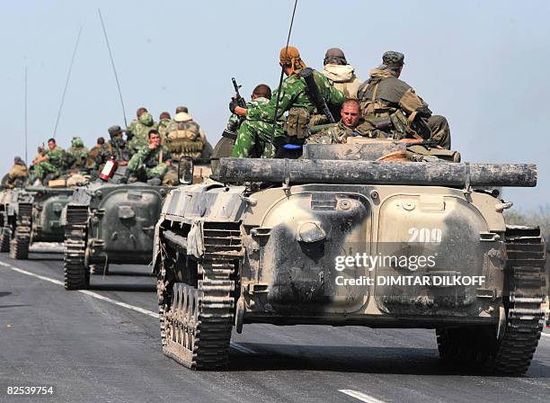 Column of Russian armoured vehicles travel on the Gori-Tbilisi road near the village of Khurvaleti on August 22, 2008. If Russia recognises Georgia's...