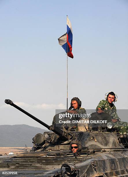 Russian APC travels on the Gori-Tbilisi road near the village of Khurvaleti on August 22 towards the South Ossetian capital Tskhinvali. Around 100...