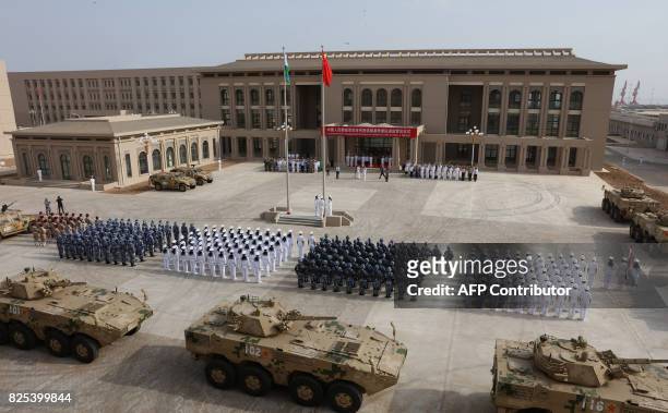 This photo taken on August 1, 2017 shows Chinese People's Liberation Army personnel attending the opening ceremony of China's new military base in...