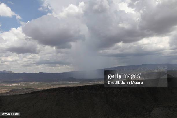 Summer shower falls in the west Texas Big Bend region long the U.S.-Mexico border on August 1, 2017 as seen from a U.S. Customs and Border Protection...