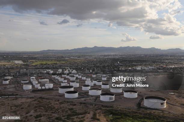 An oil refinery and tanks stand near the U.S.-Mexico border on August 1, 2017 in El Paso, Texas. San Antonio based Tesoro purchased Western Refining...