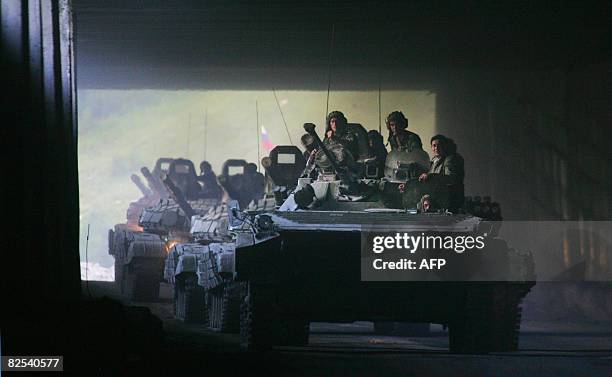 Column of Russian armoured vehicles moves towards the Roki tunnel on the border with Russia as they leave South Ossetia on August 23, 2008. Russian...
