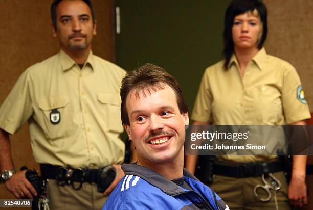 Defendant Sven Kittelmann waits for his trial for armed robbery on August 25, 2008 in Munich, Germany. Kittelmann, a former employee of a money...