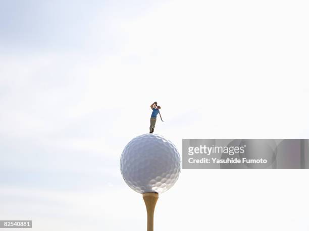 a golfer is on a golfball. - miniature golf fotografías e imágenes de stock