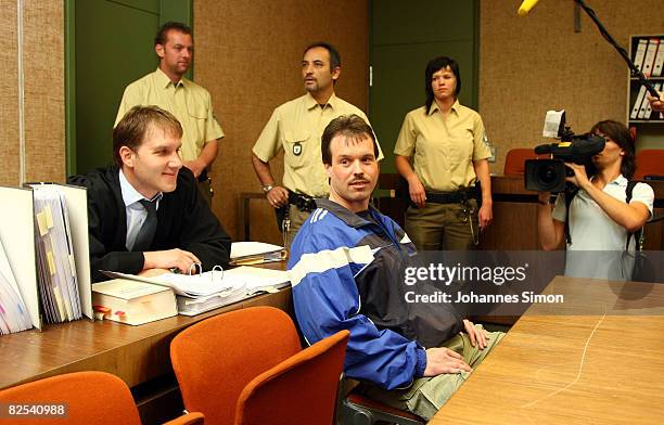 Defendant Sven Kittelmann and his lawyer Maximilian Pauls wait for his trial for armed robbery on August 25, 2008 in Munich, Germany. Kittelmann, a...