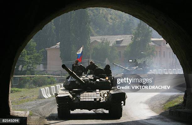 Russian tanks move toward the town of Alagir, some 40 km outside Vladikavkaz as they leave South Ossetia on August 24, 2008. The West on Sunday...