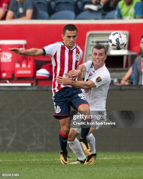 Chivas U-20s midfielder Kevin Magana and MLS Homegrown and Real Salt Lake midfielder Brooks Lennon battle for the ball in the first half during a...