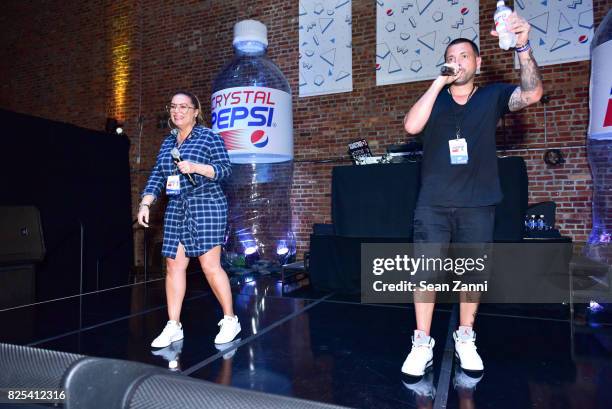 Angie Martinez and DJ Prostyle attend Crystal Pepsi Throwback Tour with Busta Rhymes at Billy's Sports Bar on August 1, 2017 in Bronx City.
