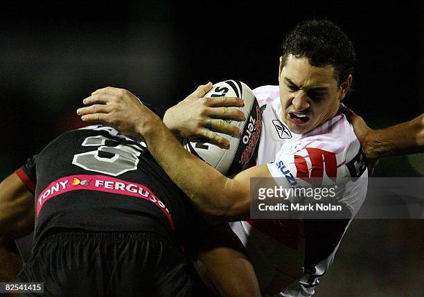Billy Slater of the Storm is tackled during the round 24 NRL match between the Penrith Panthers and the Melbourne Storm held at CUA Stadium August...