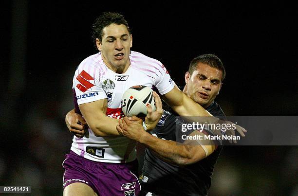 Billy Slater of the Storm is tackled by Maurice Blair of the Panthers during the round 24 NRL match between the Penrith Panthers and the Melbourne...