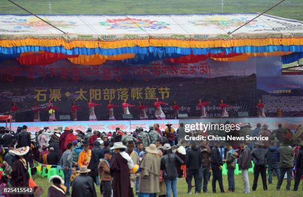 Tibetans perform during a tent festival on a grassland 4,500 meters above sea level on August 1, 2017 in Shiqu County, , Sichuan Province of China.