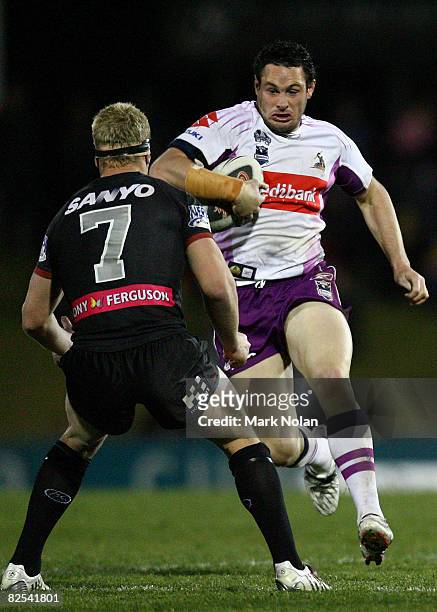 Brett White of the Storm takes on the Panthers defence during the round 24 NRL match between the Penrith Panthers and the Melbourne Storm held at CUA...