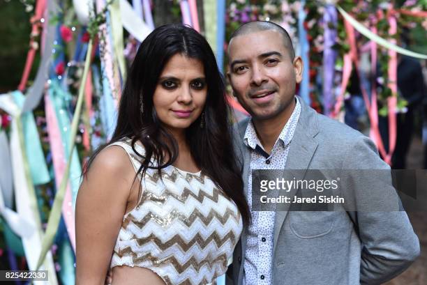 Ambika Kataria and Steve Rivera attend The 24th Annual Watermill Center Summer Benefit & Auction at The Watermill Center on July 29, 2017 in Water...
