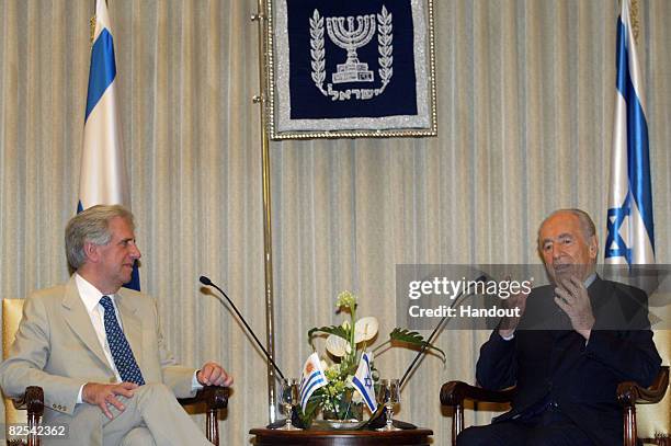 In this handout photo provided by the IPO , Israel's President Shimon Peres attends a meeting with his Uruguayan counterpart Tabare Vazquez at the...