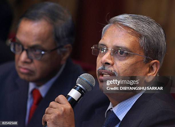 Chief Executive Officer of Infosys Technologies Limited Kris Gopalakrishnan is watched by Infosys Chief Mentor N. R. Narayanamurty as he addresses a...