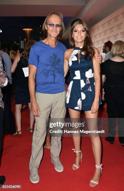 Eisi Gulp and his daughter Aliyah during the 'Griessnockerlaffaere' premiere at Mathaeser Filmpalast on August 1, 2017 in Munich, Germany.