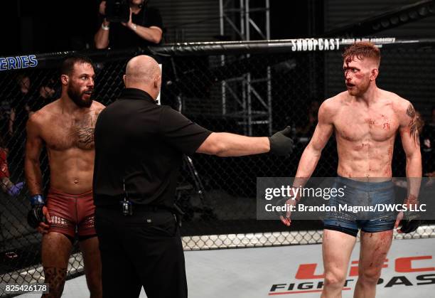 Brandon Davis and Austin Arnett stare each other down in their featherweight bout during Dana White's Tuesday Night Contender Series at the TUF Gym...