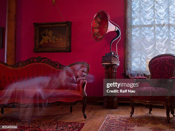 19th century female ghost listening to phonograph - fantasma foto e immagini stock