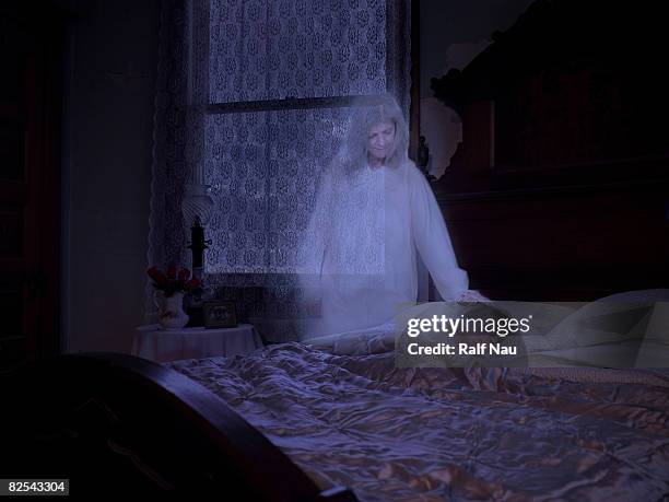 ghost touching sleeping granddaughter - child asleep in bedroom at night stock pictures, royalty-free photos & images