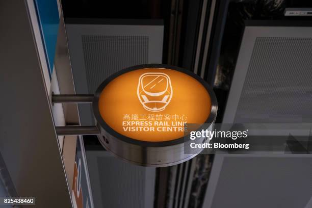 Signage for a visitor center is displayed at the West Kowloon Terminus of the Guangzhou-Shenzhen-Hong Kong Express Rail Link , developed by MTR...