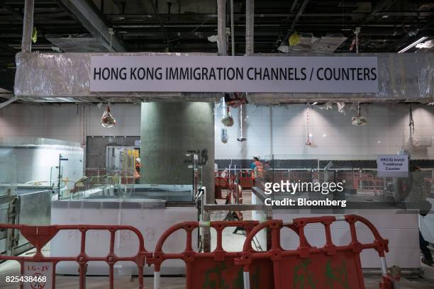 Counters for the Hong Kong immigration channels stand under construction at the West Kowloon Terminus of the Guangzhou-Shenzhen-Hong Kong Express...