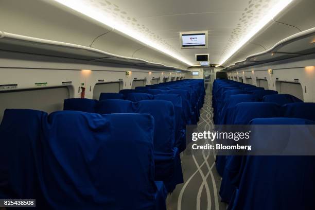 Rows of passenger seats stand inside a Guangzhou-Shenzhen-Hong Kong Express Rail Link train in Hong Kong, China, on Wednesday, Aug. 2, 2017. The Hong...