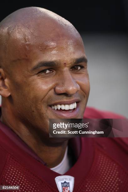 Jason Taylor of the Washington Redskins watches play against the Carolina Panthers at Bank Of America Stadium on August 23, 2008 in Charlotte, North...