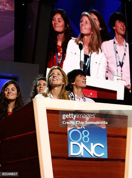 Daughters Rose Schlossberg and Tatiana Schlossberg, Caroline Kennedy Schlossberg and son Jack Schlossberg stand at the podium before the first...