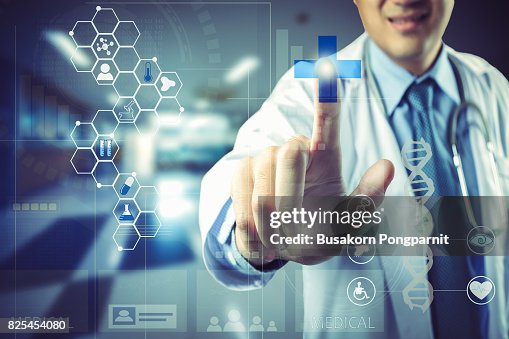 Medical doctor touching virtual interface button of healthcare application Medical doctor touching virtual interface button of healthcare application