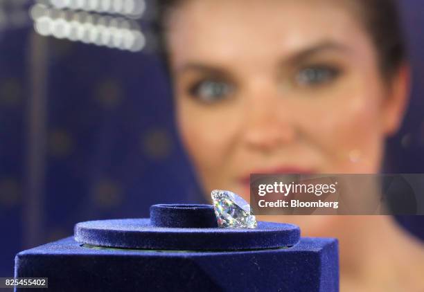 The 'Dynasty' diamond, cut from the 179-carat Romanov rough diamond discovered by Alrosa PJSC, sits in a display cabinet during its unveiling in...