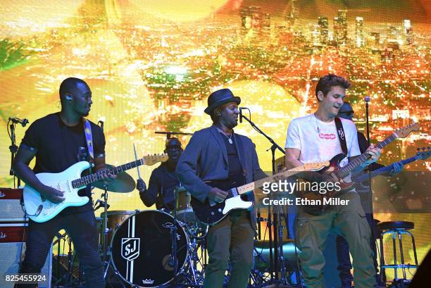 Guitarist Isaiah Sharkey and singer/songwriter David Ryan Harris perform with recording artist John Mayer during a stop of The Search for Everything...