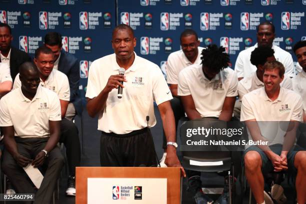 Ambassador Dikembe Mutombo speaks to the crowd during the Basketball Without Borders Africa press conference at the American International School of...