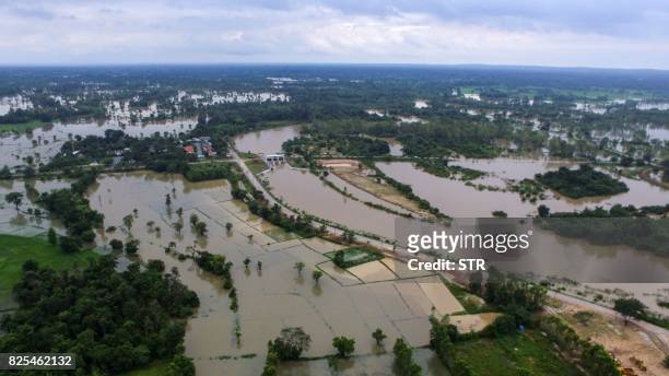 This picture by Thailand's Dailynews taken on July 28, 2017 shows floodwaters engulfing an unidentified town in Nakae District of Nakhon Phanom in...