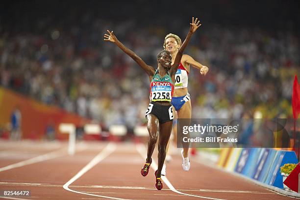 Summer Olympics: Kenya Eunice Jepkorir victorious after winning Women's 3000M Steeplechase Final silver medal at National Stadium . Beijing, China...