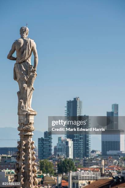 statues, milan cathedral (duomo di milano) - spire stock pictures, royalty-free photos & images