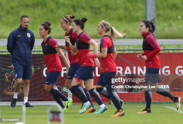 Mark Sampson, head coach of England watches his players warm up during the England Training Session at Sporting 70 on August 2, 2017 in Utrecht,...