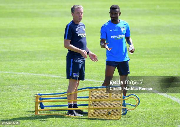 Assistant coach Rainer Widmayer and Salomon Kalou of Hertha BSC chat during the training camp on august 2, 2017 in Schladming, Austria.