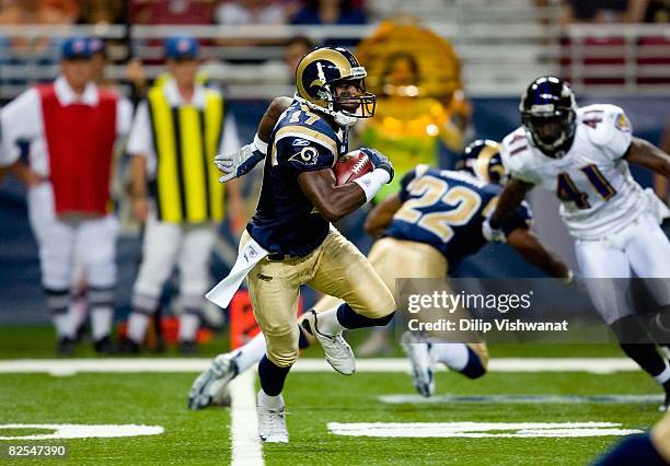 Donnie Avery of the St. Louis Rams runs the ball for yardage during the NFL game against Baltimore Ravens at the Edward Jones Dome on August 23, 2008...