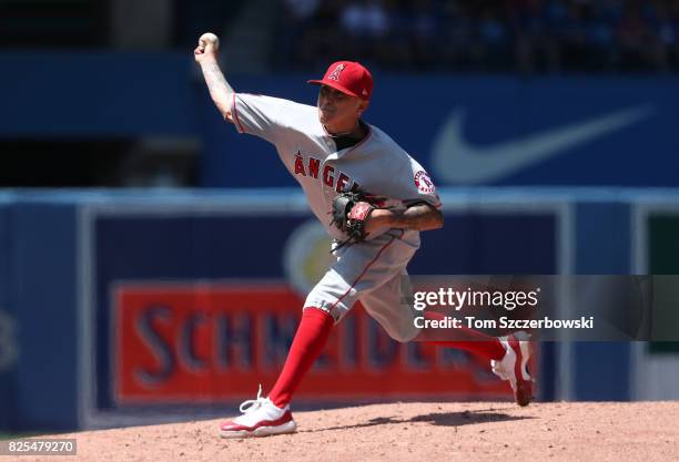 Jesse Chavez of the Los Angeles Angels of Anaheim delivers a pitch in the second inning during MLB game action against the Toronto Blue Jays at...