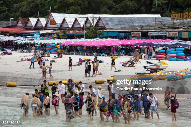 On Koh Larn island off the coast of Pattaya Chinese groups head to a speed boat to take them back to the city after some beach time on July 30, 2017...