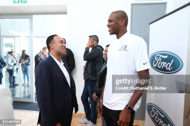 Deputy Commissioner Mark Tatum speaks with James Jones during the Basketball Without Borders Africa at the American International School of...